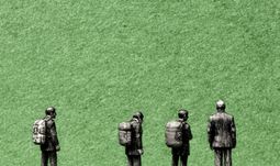 some men with rucksacks against a green background