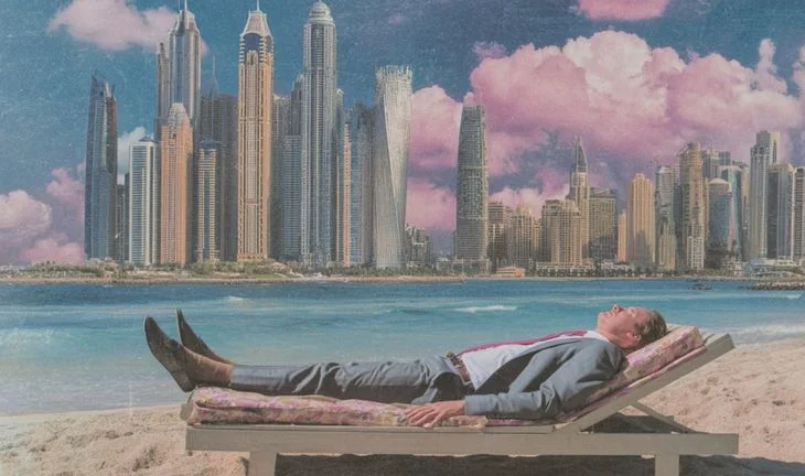 A man on a beach on a sun lounger 