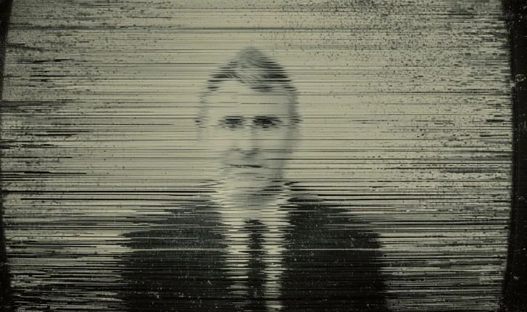 Ken Griffin on a blurred TV 