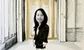 Shermaine Chia in front of a gold door 
